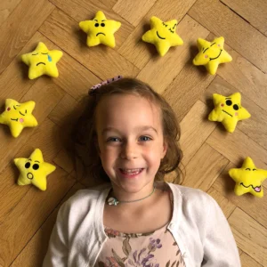 Girl surround by My Mood Stars set of 8 plushie mood stars