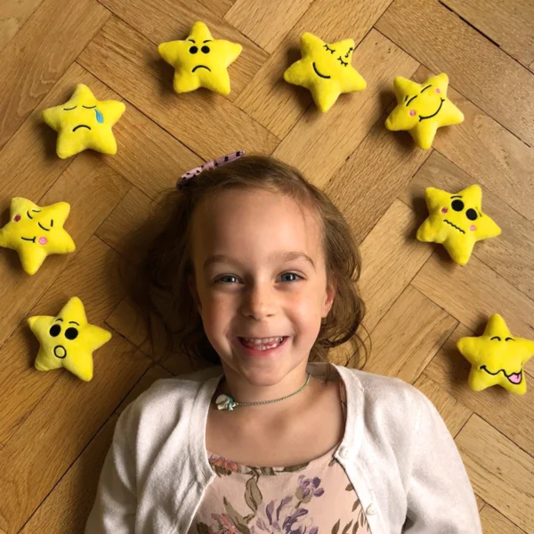 Girl surround by My Mood Stars set of 8 plushie mood stars